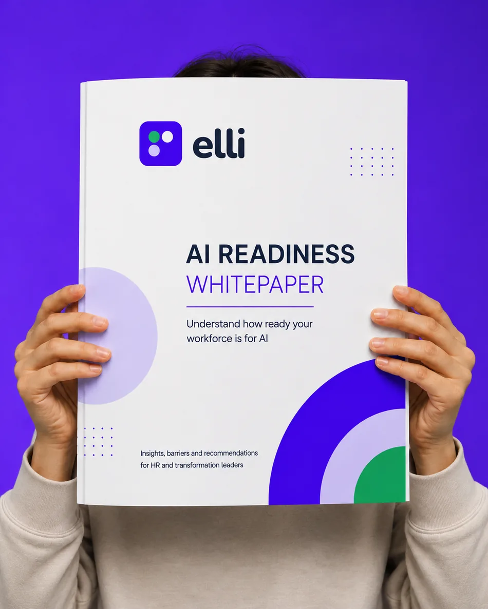 Person holding the elli AI readiness whitepaper.